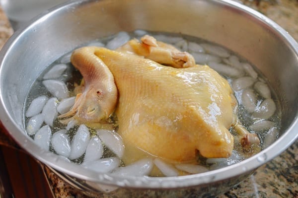Poached chicken in ice water, thewoksoflife.com